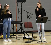 two people singing at big gifted give event