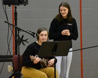 person playing instrument at big gifted give event