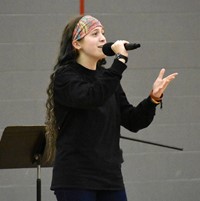 another person singing at big gifted give event