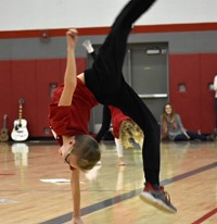 student doing a back flip