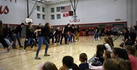 wide shot of high school musical students performing