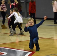 student dancing at big gifted give