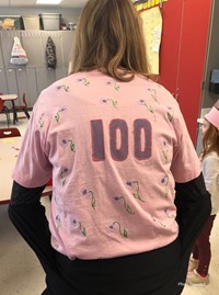 teacher wearing 100th day shirt