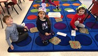 three students taking part in 100th day activities