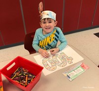 student smiling on 100th day of school