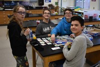 group of students playing monopoly