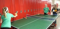 students playing ping pong