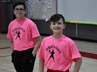 two students wearing dodgeball shirts