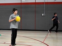 student about to throw dodgeball