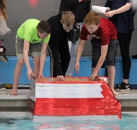 students preparing boat