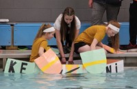 students getting in boat