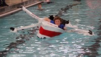 student paddling boat
