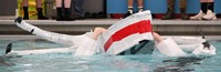 student paddling in boat