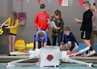 students preparing boat