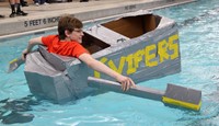 student paddling boat