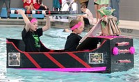 two students paddling boat
