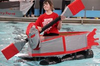 student paddling boat