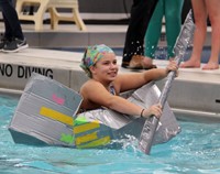 student paddling boat