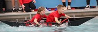 two students paddling boat