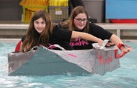 two students paddling