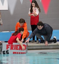 student getting into boat