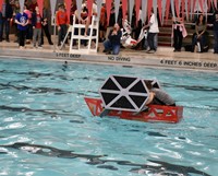 students paddling boat