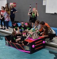 students preparing boat