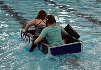 two students paddling