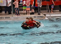 two students paddling