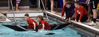 two students setting off in boat