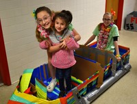 students sitting in boat