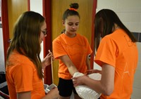 students preparing paddles