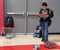 two students working with robots