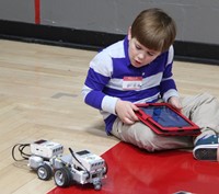 student working with robot