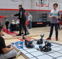 students working with robots