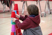 student stacking cups