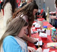 additional students at steam night station