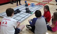 students at robotics station