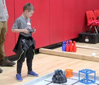 student working with robot