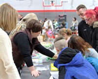 people at steam night station