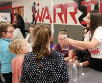 additional students at steam night station