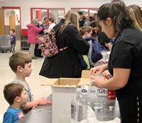 additional students at steam night station