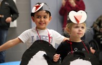 two students in penguin parade