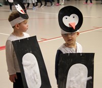 two students in penguin parade