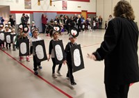 students and teacher in penguin parade