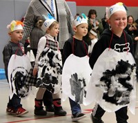 four students in penguin parade