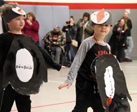 two students in penguin parade