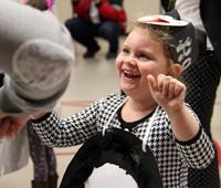 student smiling and dancing