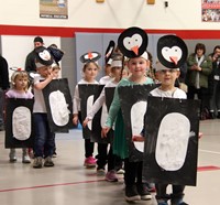 multiple students in penguin parade