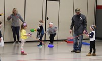 students and adults participating in games